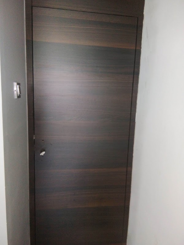 Minimalist White & Dark Wood Door Frame Detailing